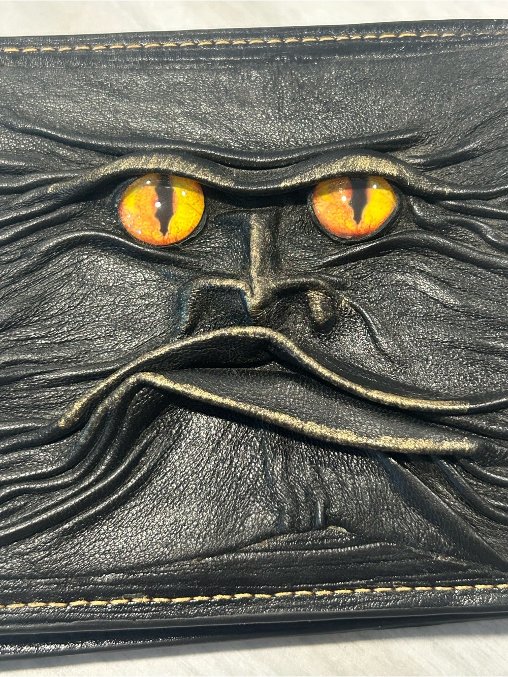 Men's Black Leather Bi-Fold Wallet with Embossed Face and Yellow Eye Accent - Picture 14 of 14